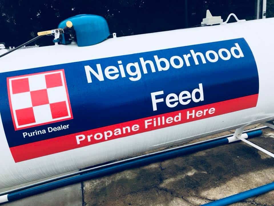 propane tank with Neighborhood Feed written on the side